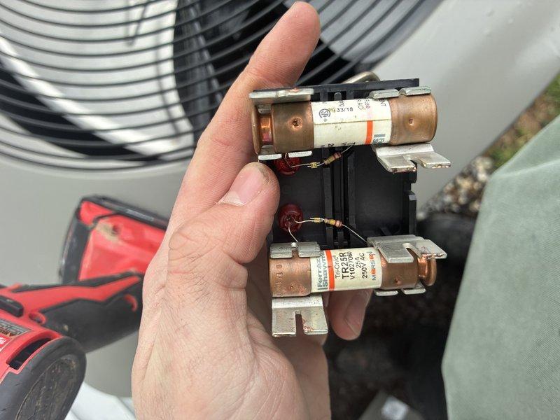 Completed comprehensive AC tune-up including inspection of electrical components and humidifier system. Removed and examined contactor assembly with dual fuses, verified proper operation and connections. Inspected humidifier evaporator pad for mineral buildup and airflow efficiency, confirmed unit accessibility and all electrical connections secure.