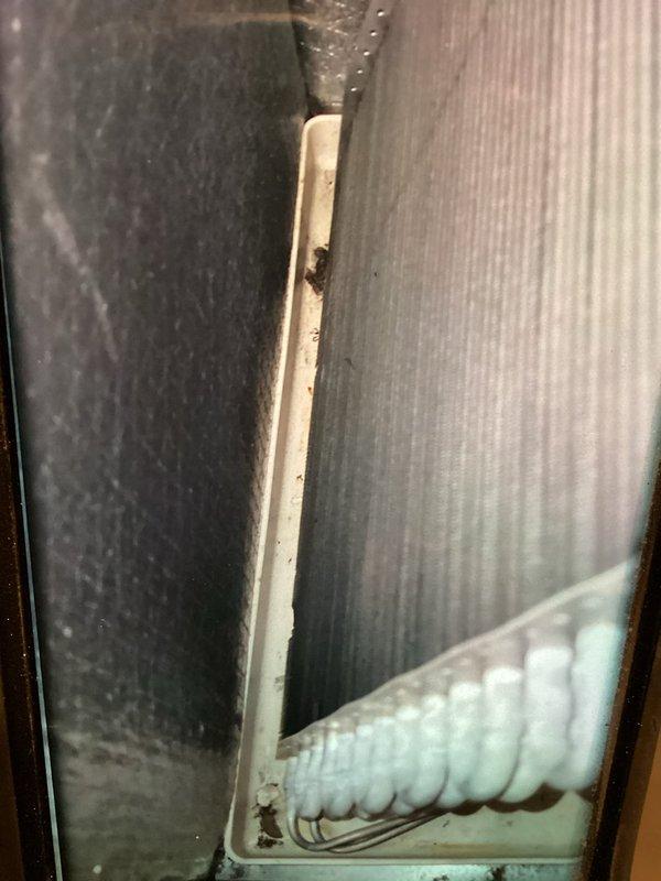 Completed comprehensive AC tune-up and maintenance inspection on cooling system. Verified electrical components including TR30R fuses rated at 600V AC, confirming proper amperage ratings and secure connections within the disconnect panel. Inspected ductwork assembly and metal panels in mechanical space, noting all components properly fitted and secured with minor dust accumulation typical of normal operation.