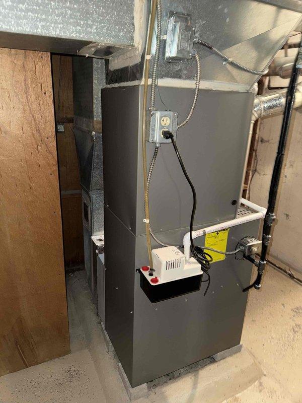 Completed scheduled MVP cooling maintenance visit on residential HVAC system. Performed comprehensive inspection of furnace/air handler unit, verified proper operation of all mechanical components, and checked electrical connections and controls. Documented equipment condition with photos showing unit, ductwork connections, condensate management system, and associated plumbing lines in proper working order.