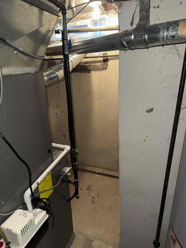 Completed scheduled MVP cooling maintenance visit on residential HVAC system. Performed comprehensive inspection of furnace/air handler unit, verified proper operation of all mechanical components, and checked electrical connections and controls. Documented equipment condition with photos showing unit, ductwork connections, condensate management system, and associated plumbing lines in proper working order.