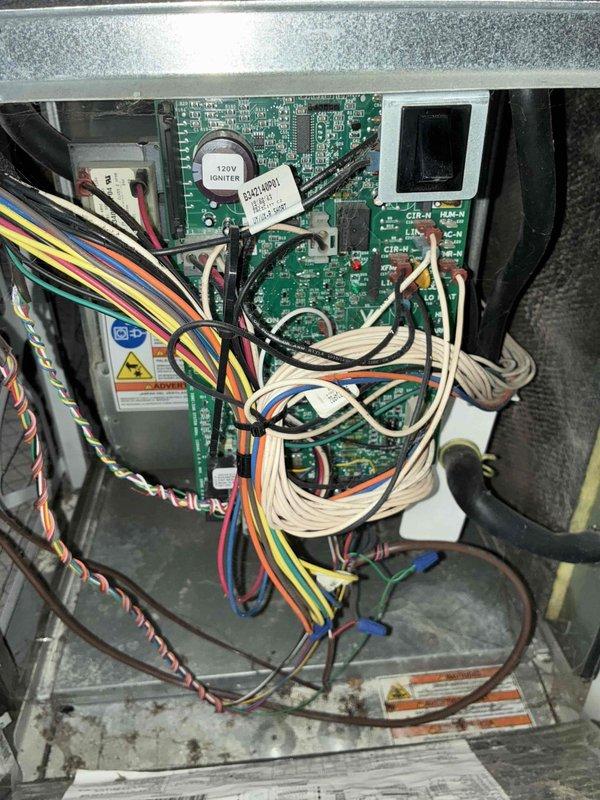 Completed comprehensive AC tune-up service on residential HVAC system. Performed visual inspection of control boards, electrical connections, and wiring harnesses within the unit, verified proper operation of blower motor assembly, and documented system condition with interior component photography. All components found in satisfactory operating condition with normal wear patterns observed.