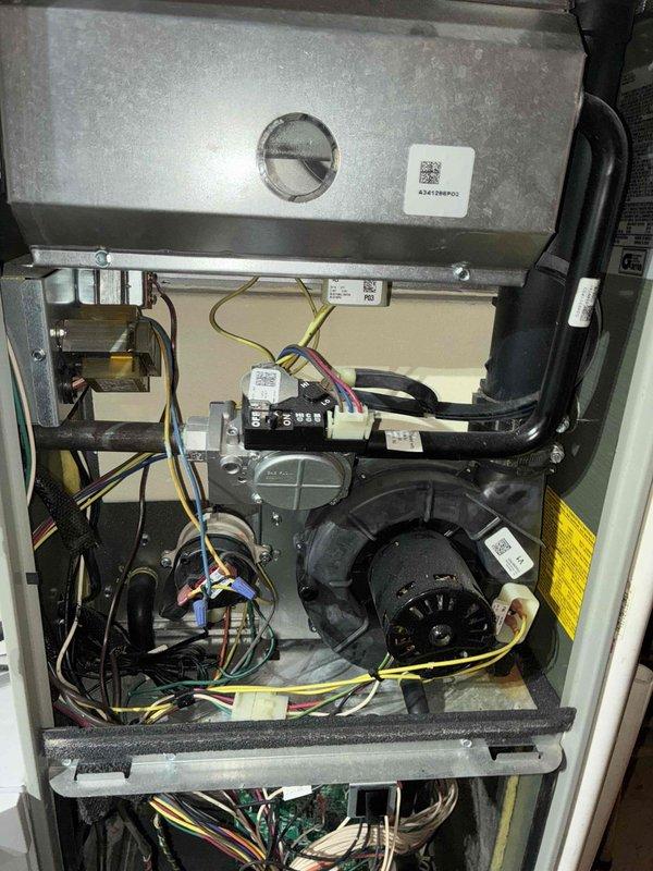 Completed comprehensive AC tune-up service on residential HVAC system. Performed visual inspection of control boards, electrical connections, and wiring harnesses within the unit, verified proper operation of blower motor assembly, and documented system condition with interior component photography. All components found in satisfactory operating condition with normal wear patterns observed.