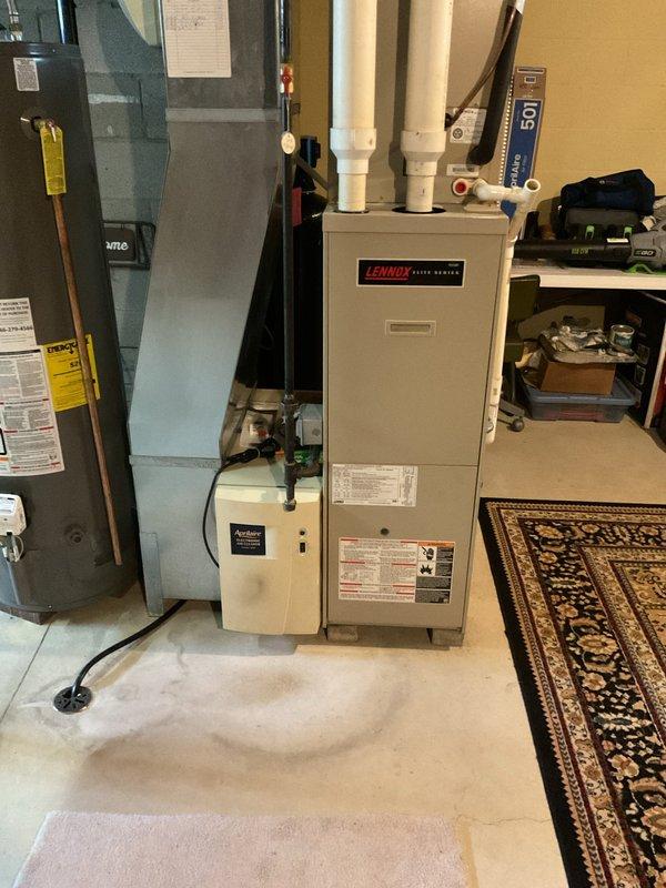 Completed comprehensive maintenance on 25+ year old Lennox gas furnace system. Performed full inspection of burner assembly, heat exchanger, blower motor, and all electrical connections. Cleaned and tested ignition system components visible through inspection port. Verified proper operation of integrated Aprilaire humidifier unit mounted to furnace. Checked all gas connections, flue piping, and condensate drainage system for proper function. Unit operating within normal parameters at time of service completion.
