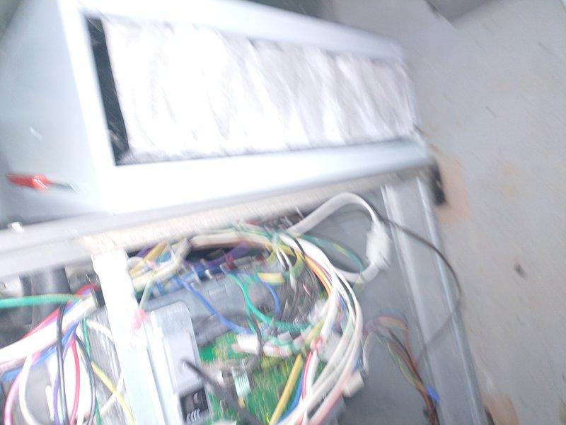 Completed MVP recurring cooling maintenance visit on outdoor air conditioning condenser unit. Performed comprehensive system inspection including examination of exterior cabinet condition, electrical connections at control board, and overall unit operation. Documented equipment condition with photographic records showing condenser placement, top grille assembly, and internal control board wiring configuration. All components inspected and system verified operational per maintenance protocol.