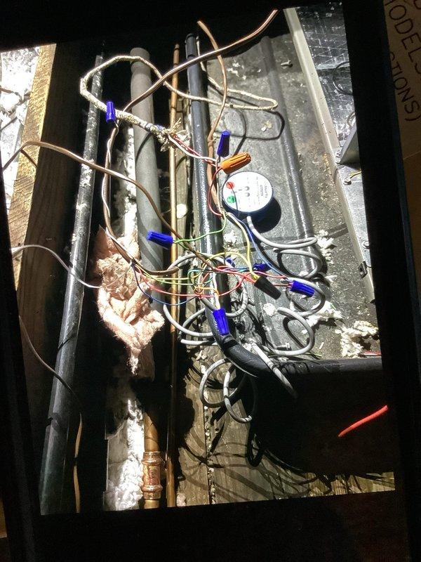 Responded to service call for newly installed air conditioning system running continuously without cycling off. Inspected system components in attic space including electrical connections, control wiring, and thermostat circuit. Identified faulty thermostat wiring connection preventing proper communication between thermostat and air handler. Corrected wire terminations at air handler junction, verified proper voltage at control board, and tested system operation through multiple cooling cycles. Unit now cycling properly with thermostat commands.