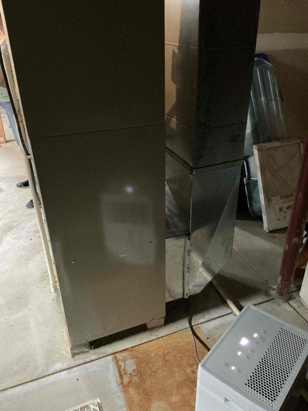 Conducted comprehensive on-site assessment for complete furnace and air conditioning system replacement. Evaluated existing HVAC equipment, ductwork configuration, and utility connections in basement mechanical room. Documented current system layout including water heater proximity, PVC venting arrangements, metal ductwork routing through ceiling joists, and available clearances for new equipment installation. Provided detailed estimate for replacement system based on observed conditions and spatial requirements.