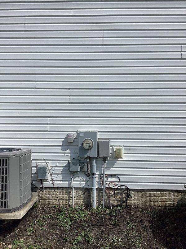 Responded to circuit breaker tripping issue after ceiling fan removal. Inspected electrical junction box and wiring connections in ceiling fixture location. Found exposed wiring with multiple wire nut connections requiring evaluation. Documented existing electrical configuration and exterior service equipment for troubleshooting purposes.