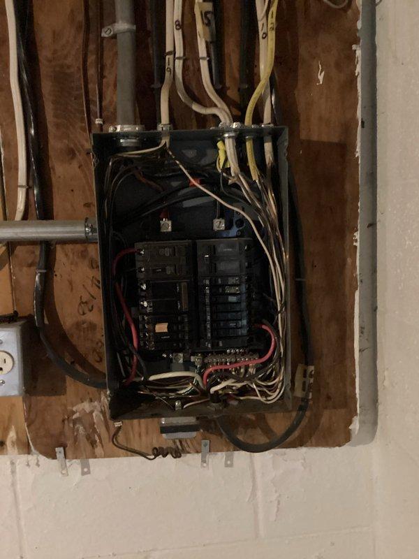 Responded to pre-sale home inspection findings regarding electrical panel deficiencies. Upon arrival, identified improper wire bundling, disorganized conductor routing, and potential code violations within the main service panel. Reorganized and secured all branch circuit wiring per NEC standards, ensuring proper color-coded conductor separation and strain relief at panel entry points. Verified all circuit breaker connections were tight and properly seated on bus bars, corrected neutral wire terminations, and confirmed adequate working clearances around electrical equipment. All circuits tested and operational upon completion, with panel ready for final inspection approval.