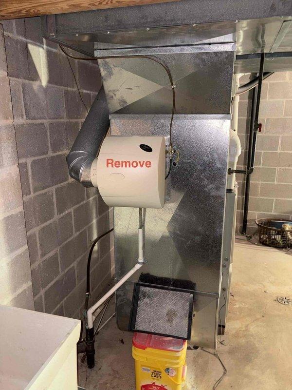Conducted furnace replacement estimate at residential property. Unit is located in confined basement mechanical room with limited access, requiring removal for proper service or replacement. Provided quote for new equipment installation with appropriate labor considerations due to challenging installation conditions.