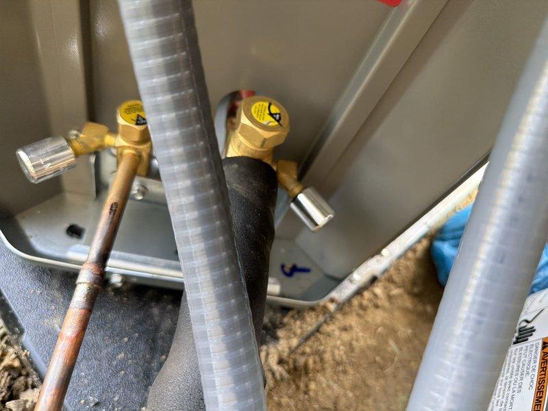 Completed full HVAC system installation including AC unit and tankless water heater. Installed new electrical disconnect with FLNR 25A fuses and proper wiring connections for equipment protection. Ran and insulated copper refrigerant lines and water supply lines using foam pipe insulation to prevent heat loss and condensation. Installed isolation valves with service ports on water lines for future maintenance access. Secured all piping, verified electrical connections, and ensured proper clearances for safe operation and code compliance.