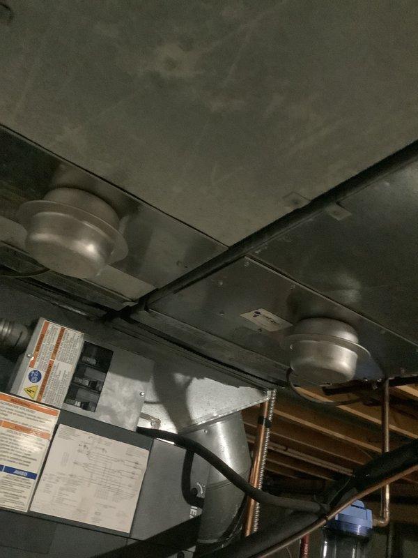 Provided comprehensive estimate for complete heat pump system replacement at residential property. Existing 14-year-old Trane air handler unit currently installed in basement utility area showing age-related wear and approaching end of serviceable life. Evaluated current system configuration including air handler, ductwork connections, condensate drainage system, and associated mechanical components. Documented equipment specifications, installation conditions, and existing infrastructure through detailed photographs of air handler unit, surrounding ductwork, PVC condensate lines, and mounting configuration. Assessed accessibility for replacement equipment installation in existing utility space alongside water heater and other mechanical systems. Quoted complete system replacement to restore efficient heating and cooling capacity for the residence.