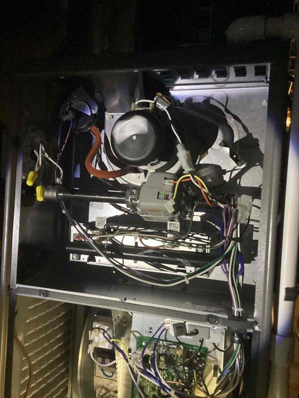 Completed scheduled MVP heating maintenance visit on residential HVAC system. Performed comprehensive inspection of furnace unit with access panels removed to evaluate all internal components. Examined blower motor assembly, verified proper electrical connections throughout system including multiple wire harnesses and terminal blocks. Inspected control boards, circuit boards, and electronic components for proper operation. Checked blower housing and verified all safety controls and wiring connections were secure. System found to be operating within normal parameters with all components functioning properly.