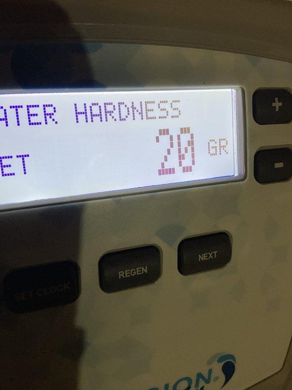 Delivered and loaded water softener salt from warehouse inventory into customer's brine tank. Verified system settings showed water hardness configured at 20 grains and confirmed proper salt level for optimal softener operation.