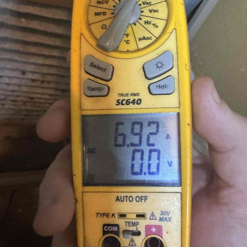Performed comprehensive tune-up on combined heating and cooling system in residential condo unit. Conducted full system inspection including electrical measurements using digital multimeter, recording 692-volt reading on heating elements. Inspected electric heating coil assembly, verified all coil springs intact and properly mounted on frame with ceramic insulators in good condition and electrical connections secure. Cleaned and tested all components, confirmed system operational and ready for continued service.