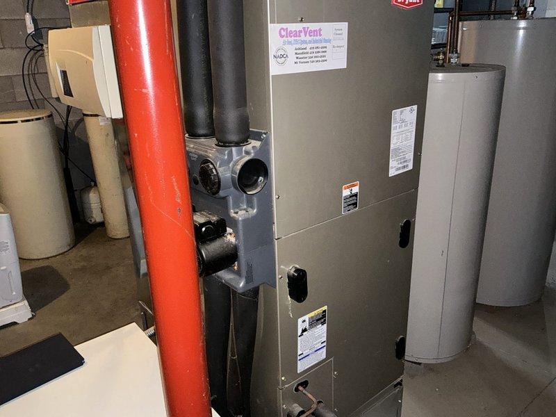 Completed geothermal system estimate for residential property. Assessed existing mechanical room configuration including current water heater, furnace with ClearVent system, and associated HVAC infrastructure to determine feasibility and requirements for geothermal heat pump installation. Documented existing equipment layout, electrical panel capacity, available space for ground loop connections, and plumbing configuration to prepare comprehensive replacement proposal.