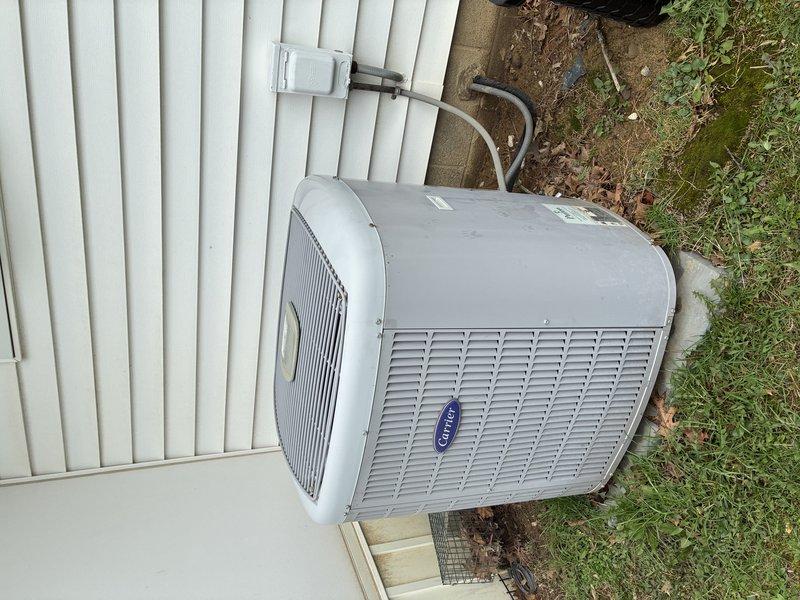 Completed routine MVP cooling maintenance visit on Carrier outdoor condensing unit. Inspected refrigerant lines, electrical disconnect, and overall system operation. Examined and documented electrical fuses showing signs of oxidation and wear on copper terminals and end caps, indicating extended service life and potential need for future replacement monitoring.