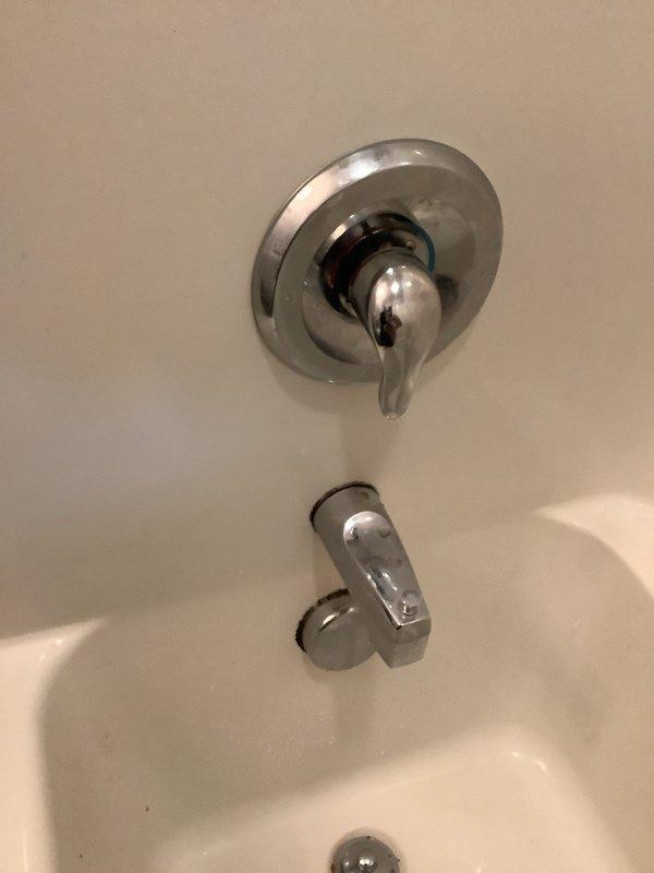 Responded to service call for noisy shower valve operation. Conducted on-site assessment of bathroom shower and tub fixture system. Inspected single-handle shower control valve with chrome trim and circular escutcheon plate mounted on tiled wall. Examined internal valve components, noting mechanical assembly and operational characteristics contributing to noise issue. Evaluated tub spout with diverter mechanism and overall plumbing configuration. Documented existing fixture conditions through photographs showing shower control assembly, wall-mounted hardware, and bathtub spout installation. Provided comprehensive quote for complete shower valve replacement to resolve noise concern and ensure proper fixture operation.