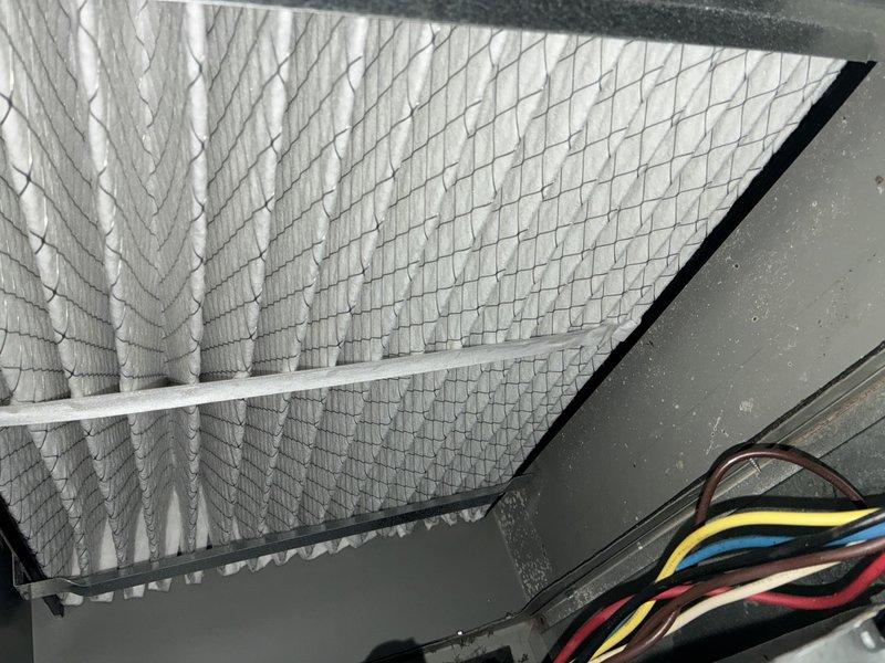 Completed MVP recurring cooling maintenance visit on rooftop HVAC system. Inspected Aprilaire air handler unit, examined evaporator coil with diamond-pattern mesh filter media, and verified proper electrical connections and wire routing. All components found in satisfactory operating condition with no immediate service needs identified.