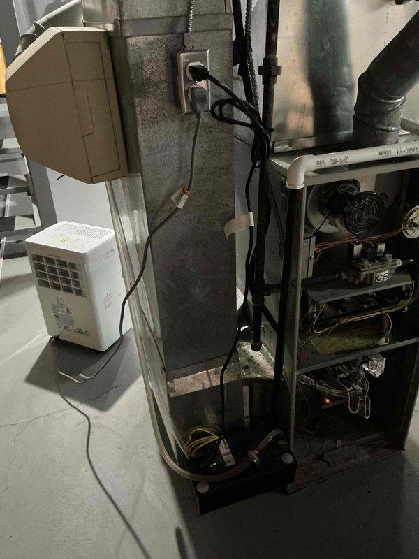 Conducted on-site assessment for furnace replacement in residential basement utility space. Evaluated existing HVAC system with exposed internal components including blower motor assembly, refrigerant lines, and electrical connections. Documented current equipment configuration, ductwork connections, and electrical service setup. Provided comprehensive replacement estimate for new furnace system installation with confirmation pending on equipment specifications and labor requirements.