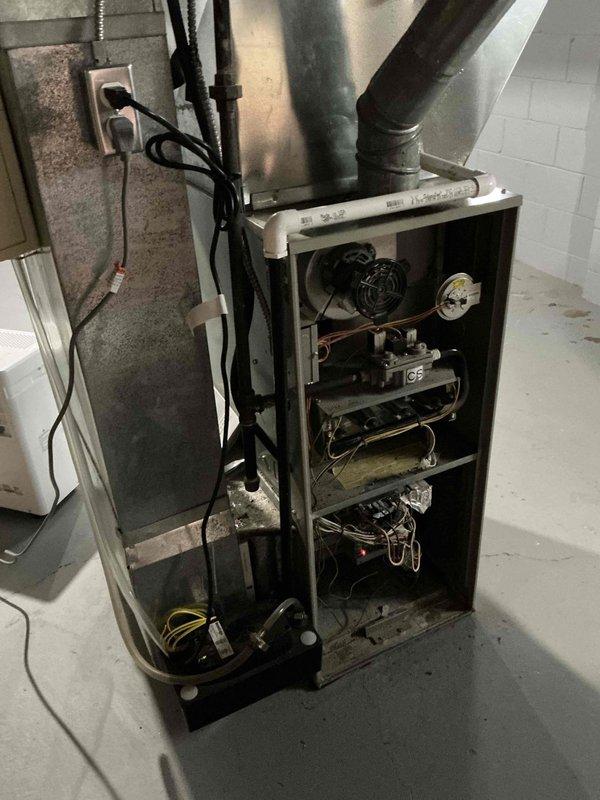 Conducted on-site assessment for furnace replacement in residential basement utility space. Evaluated existing HVAC system with exposed internal components including blower motor assembly, refrigerant lines, and electrical connections. Documented current equipment configuration, ductwork connections, and electrical service setup. Provided comprehensive replacement estimate for new furnace system installation with confirmation pending on equipment specifications and labor requirements.