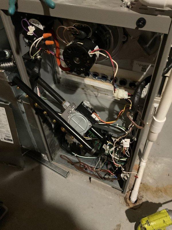 Responded to no-heat call on a 2-year-old furnace system. Upon arrival, performed diagnostic inspection of the unit's control board, blower motor assembly, and gas valve components. Inspected all electrical connections, wire harnesses, and terminal blocks for proper continuity and secure connections. Verified control board LED indicators and tested blower motor operation. Examined gas valve assembly and associated black iron piping for proper function. Restored heat operation to the system and confirmed normal furnace cycling.