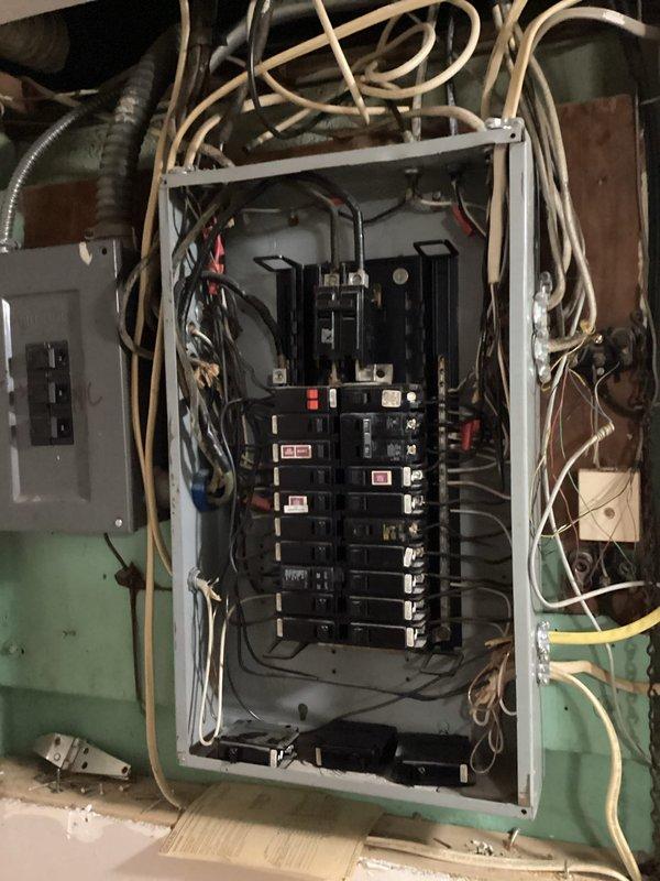 Installed dedicated electrical circuit wiring for air handler unit in attic space. Ran new conductors from main electrical panel through utility area to attic location, terminating at air handler condensate pan area. Connected circuit protection at panel and secured all wiring per code requirements.