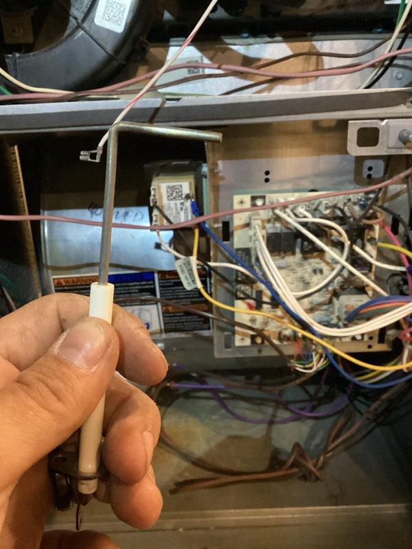 Completed scheduled heating maintenance visit following previous cooling system service. Performed comprehensive inspection of HVAC unit interior components, including examination of blower motor assembly, electrical connections, control board, and wiring harness. Verified proper operation of flame sensor, inspected capacitor condition, and checked all wire terminations for secure connections. Documented system condition through photographic records showing internal components, sensor assembly, and electrical infrastructure. All heating system components found to be in satisfactory operating condition with no immediate repairs required.
