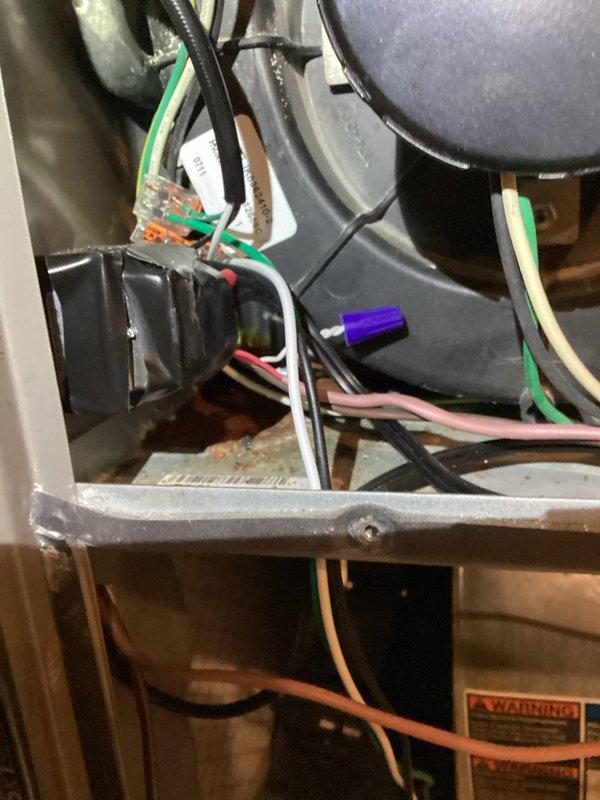 Completed scheduled heating maintenance visit following previous cooling system service. Performed comprehensive inspection of HVAC unit interior components, including examination of blower motor assembly, electrical connections, control board, and wiring harness. Verified proper operation of flame sensor, inspected capacitor condition, and checked all wire terminations for secure connections. Documented system condition through photographic records showing internal components, sensor assembly, and electrical infrastructure. All heating system components found to be in satisfactory operating condition with no immediate repairs required.