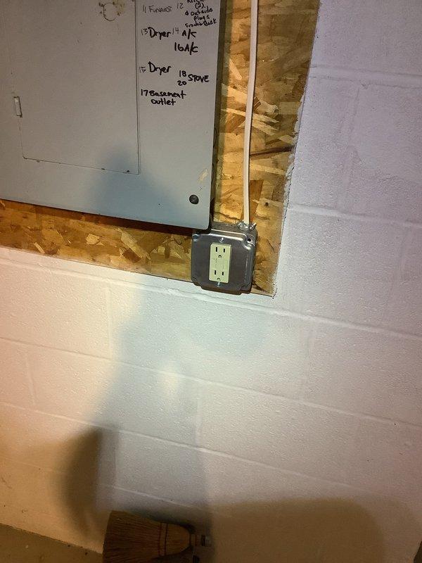 Installed GFCI breaker for washer circuit and replaced multiple GFCI outlets throughout the residence, including kitchen counter receptacles near sink, hallway outlet with missing ground connection, and second floor bathroom outlet. Replaced main panel GFCI breaker and ran new grounding conductor to ensure proper ground fault protection and code compliance throughout the electrical system.