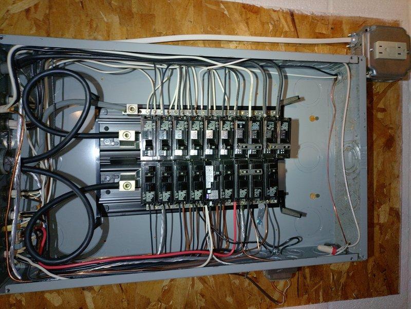 Installed GFCI breaker for washer circuit and replaced multiple GFCI outlets throughout the residence, including kitchen counter receptacles near sink, hallway outlet with missing ground connection, and second floor bathroom outlet. Replaced main panel GFCI breaker and ran new grounding conductor to ensure proper ground fault protection and code compliance throughout the electrical system.