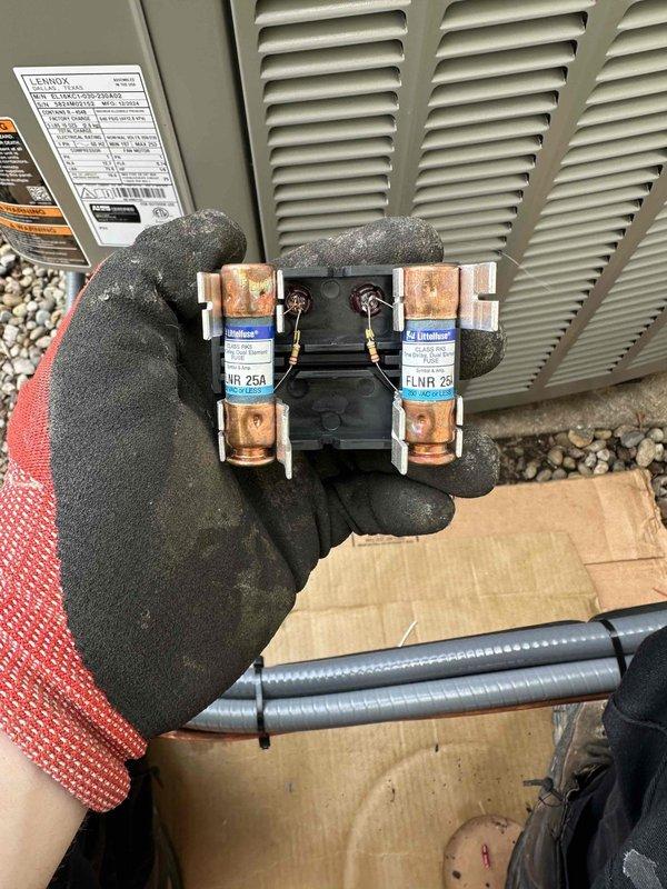 Completed full HVAC system installation including new 90% efficiency furnace and air conditioning condenser unit. Installed outdoor AC unit on gravel pad with proper clearances, connected refrigerant lines to house, mounted electrical disconnect box with 25A fuses on exterior wall, ran electrical conduit and wiring to unit, and installed new flue venting system for high-efficiency furnace. All electrical connections secured, system tested and verified operational.