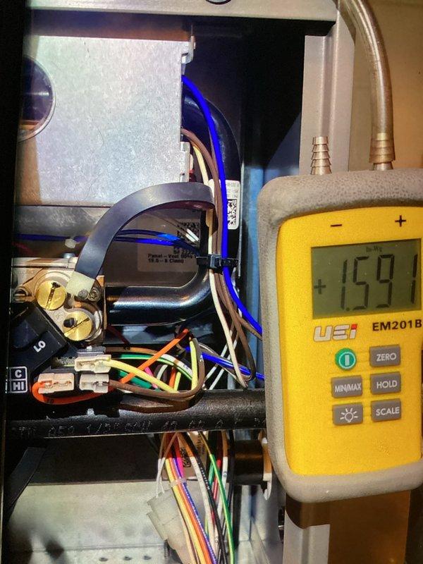 Completed MVP recurring maintenance visit on 2-year-old gas furnace. Performed comprehensive system diagnostics including temperature differential measurements across heat exchanger, recording 159.1°F outlet temperature using calibrated digital thermometer. Inspected all electrical connections, terminal blocks, and wiring harnesses for proper termination and signs of overheating. Verified blower motor assembly operation and electrical connections. Examined gas valve assembly and associated control wiring. Inspected flue pipe connections and combustion air pathways. Checked condensate drainage system and all flexible tubing connections. All components found operating within normal parameters. System operating safely and efficiently with no deficiencies noted.