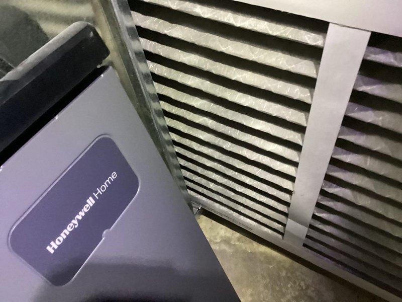 Completed scheduled preventive maintenance on Comfortmaker air conditioning system. Inspected outdoor condenser unit, verified proper operation of fan motor and compressor, checked refrigerant levels, and cleaned debris from coil surfaces. Evaluated indoor components including return air grille and Honeywell Home thermostat for proper functionality, confirmed adequate airflow throughout system, and verified all controls operating within normal parameters.