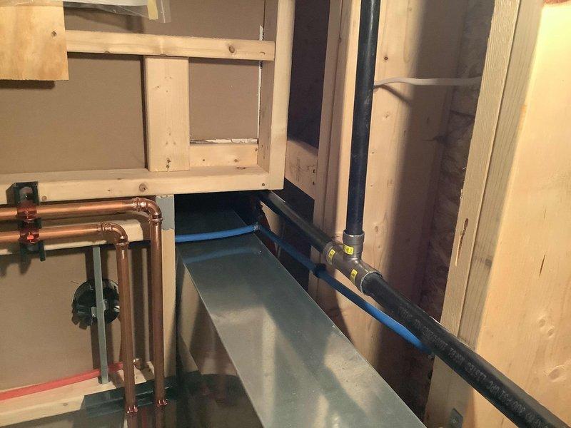 Replaced existing 40-gallon electric tank water heater with Navien NPE 240A2 tankless unit to address insufficient hot water capacity. Installed new electrical outlet to supply power to the unit. Configured venting system with exhaust and fresh air intake routed through left side of structure. Cut and installed MegaPress tee connection into existing 1-inch gas supply line for fuel source. Adapted existing CPVC water supply connections to interface with new tankless system using appropriate transition fittings. All copper piping, gas connections, and water lines installed per manufacturer specifications and local code requirements. Unit tested and operational upon completion.