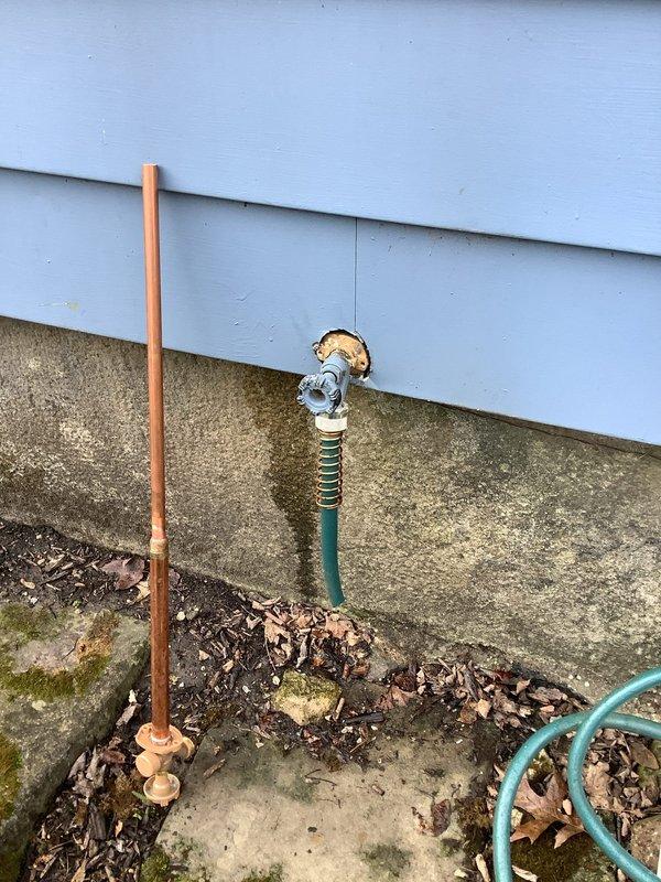 Replaced exterior hose spigot on light blue siding wall due to emergency failure. Installed new frost-free sillcock with copper supply line connection, secured proper mounting to wall structure, and verified all compression fittings in crawlspace were leak-free with adequate insulation clearance.