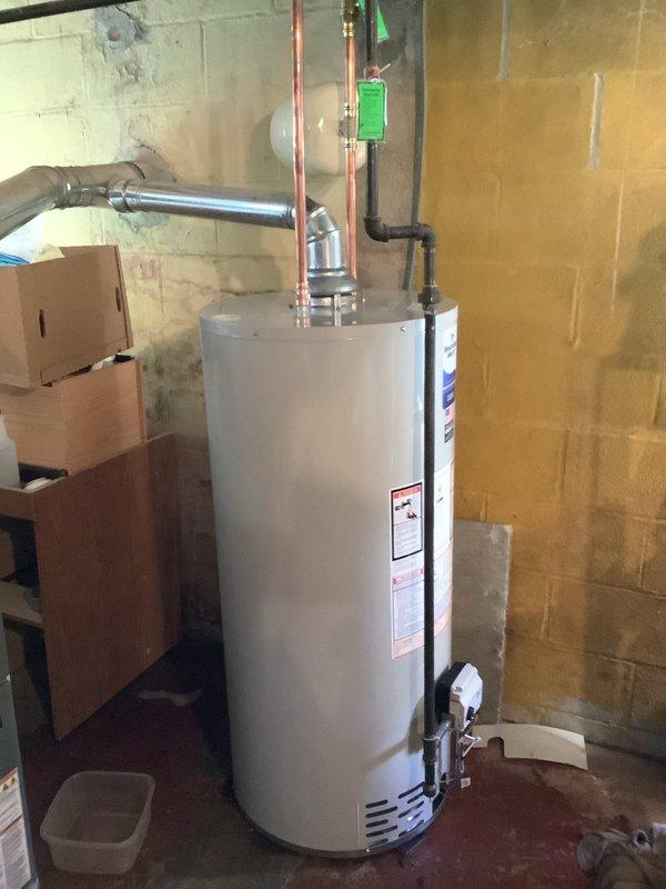 Replaced existing 40-gallon water heater with new Bradford White 40-gallon natural gas tank model BR240S6N. Installation included new water shut-off valve and thermal expansion tank to meet current code requirements. Unit features Category I natural draft venting with 40,000 BTU/hr input rating and 150 psi working pressure. All copper supply lines connected, flue pipe properly vented, and system tested for proper operation. Six-year manufacturer tank warranty applies.
