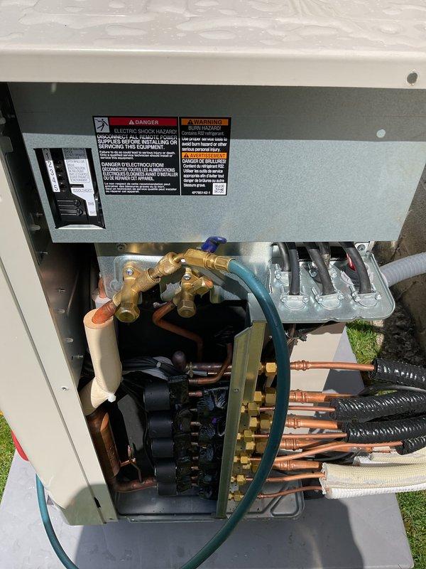 Responded to service call for recently installed mini split system displaying U0 error code indicating refrigerant shortage. Upon inspection, verified low refrigerant condition at outdoor condenser unit and addressed system deficiency to restore proper cooling operation. Indoor wall-mounted evaporator unit confirmed functioning properly following refrigerant system correction.