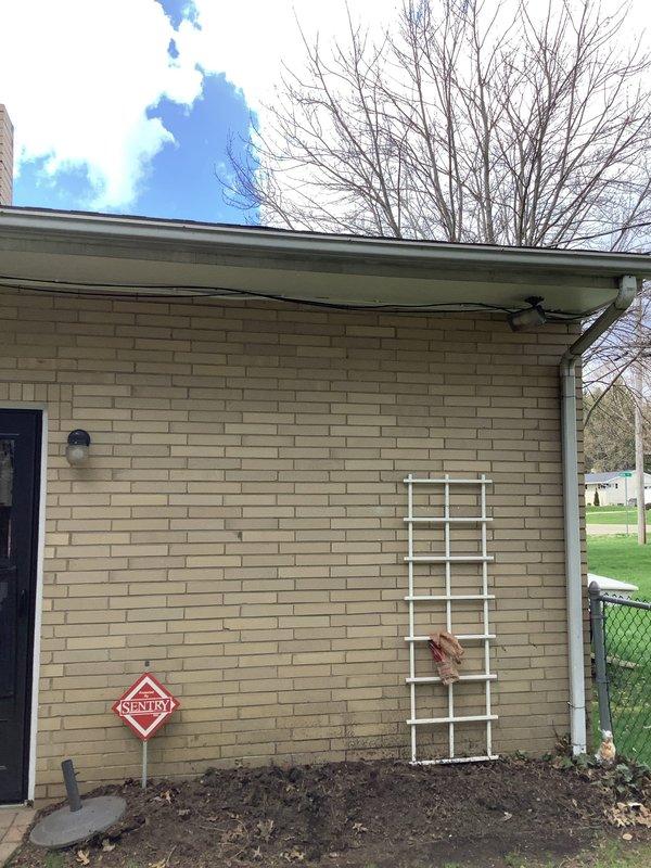 Responded to pre-sale home inspection findings regarding damaged service mast and conductors with missing or compromised insulation. Inspected exterior service entrance equipment, documented existing conditions showing deteriorated wire insulation that had been temporarily sealed with electrical tape, and assessed safety concerns. Completed necessary repairs to bring service entrance conductors up to code compliance standards, ensuring proper insulation integrity and weatherproofing of all exposed wiring at the service mast connection point.