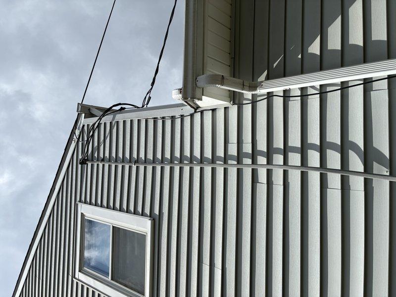 Responded to service call for breaker tripping when washer and dryer were operating simultaneously. Inspected main electrical panel, meter base, and service entrance equipment for signs of overload, loose connections, or damaged components. Verified proper operation of branch circuit breakers serving laundry appliances and confirmed adequate amperage capacity for the electrical loads. Exterior inspection of meter installation and service conductors revealed no visible defects or code violations.