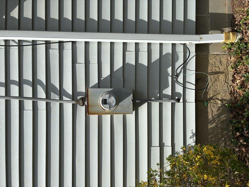 Responded to service call for breaker tripping when washer and dryer were operating simultaneously. Inspected main electrical panel, meter base, and service entrance equipment for signs of overload, loose connections, or damaged components. Verified proper operation of branch circuit breakers serving laundry appliances and confirmed adequate amperage capacity for the electrical loads. Exterior inspection of meter installation and service conductors revealed no visible defects or code violations.