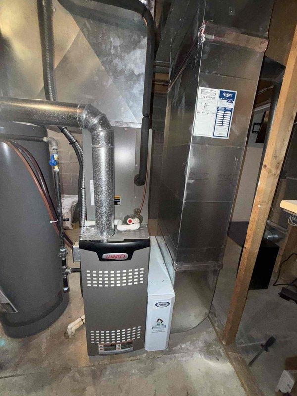 Completed seasonal air conditioning tune-up on 3-4 year old residential system. Inspected indoor air handler and outdoor condensing unit, finding heavily soiled air filter with significant accumulation of dust, debris, and organic material requiring immediate replacement. Replaced dirty filter with new unit to restore proper airflow and system efficiency. Performed standard maintenance checks on HVAC equipment located in basement mechanical room, verifying operation of furnace, air handler, and associated ductwork connections. System returned to normal operating condition with improved air quality and airflow.