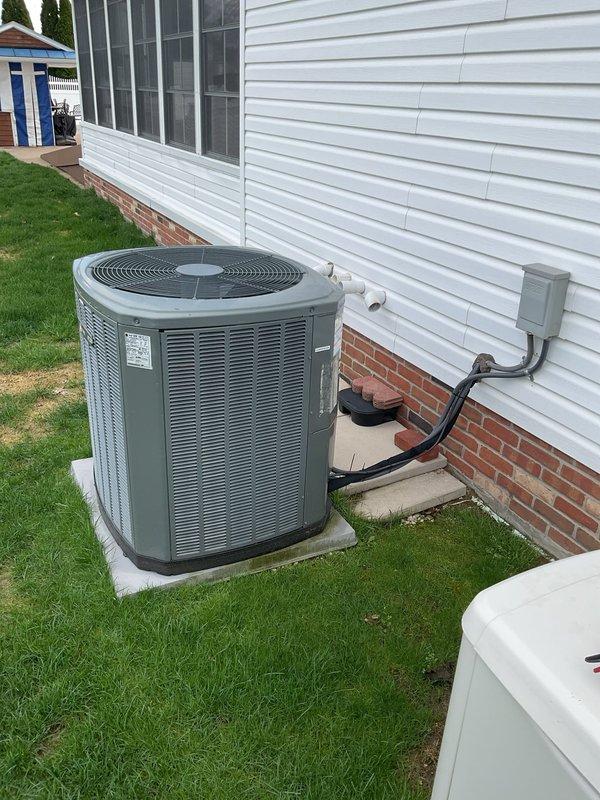 Completed MVP cooling maintenance visit on residential HVAC system. Inspected indoor air handler and verified air filter condition, noting the pleated media filter properly installed in return air housing. Proceeded to outdoor condensing unit and performed standard maintenance protocol including inspection of refrigerant line set, electrical disconnect, and overall equipment operation. Unit found operating within normal parameters with no immediate service needs identified. All components, mounting pad, and exterior connections in satisfactory condition.