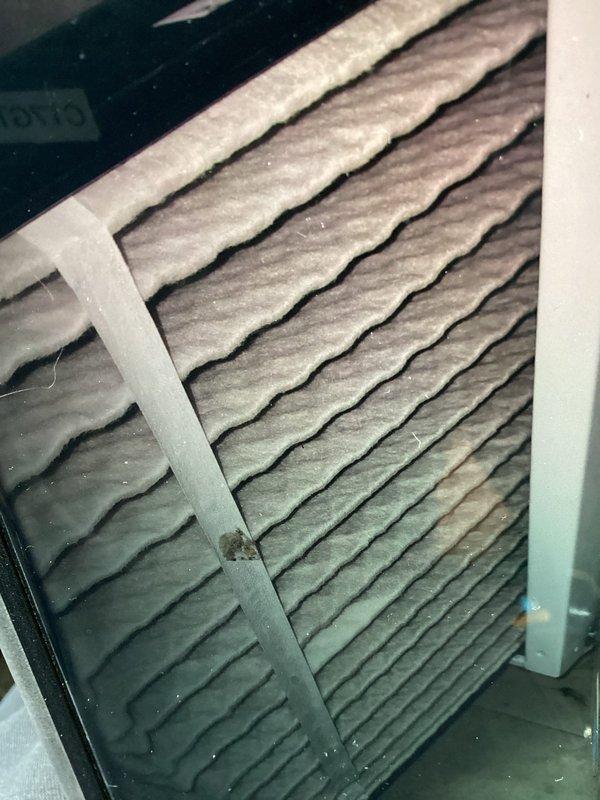 Completed annual air conditioning maintenance on 7-year-old system. Inspected and documented air filter condition showing moderate dust accumulation on pleated media, and examined time delay relay component during electrical system check. Evaluated ductwork and recommended duct cleaning services to customer for optimal system performance.