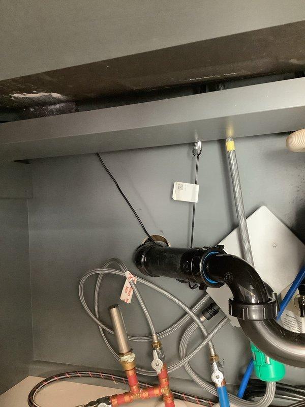 Responded to service call for foreign object lodged in basement drain line. Customer reported golf ball had fallen into drain opening. Accessed main drain cleanout in basement area to locate and remove obstruction. Successfully extracted golf ball from drain line using appropriate retrieval tools. Inspected P-trap assembly and downstream plumbing connections under sink to verify proper drainage flow and ensure no secondary blockages or damage occurred. Confirmed all drain lines flowing freely with no restrictions. Tested system operation and verified complete restoration of normal drainage function.