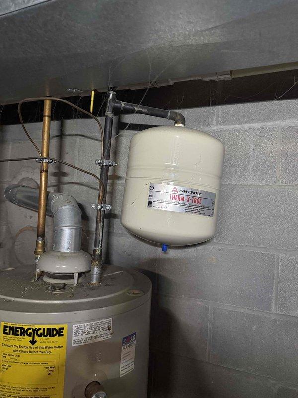 Completed scheduled MVP heating system maintenance visit. Performed comprehensive inspection of HVAC equipment including visual assessment of water heater installation, thermal expansion tank, and heating system blower assembly. Documented condition of blower wheel showing dust accumulation on blades and verified proper operation of all accessible mechanical components and ductwork systems.