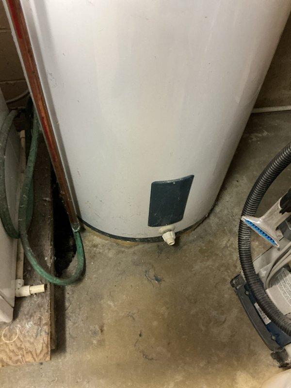 Responded to service call for 15-year-old electric water heater not producing hot water. Upon assessment, determined unit required replacement per customer request. Completed full water heater replacement, installing new Rheem electric tank unit in basement utility area. Disconnected existing copper supply lines, drained old tank, and removed from service. Installed replacement unit with proper connections to existing plumbing infrastructure, including hot and cold water copper lines secured to overhead framing. Verified all electrical connections via flexible metallic conduit, ensured proper grounding, and tested unit operation. System restored to full functionality with hot water delivery confirmed.