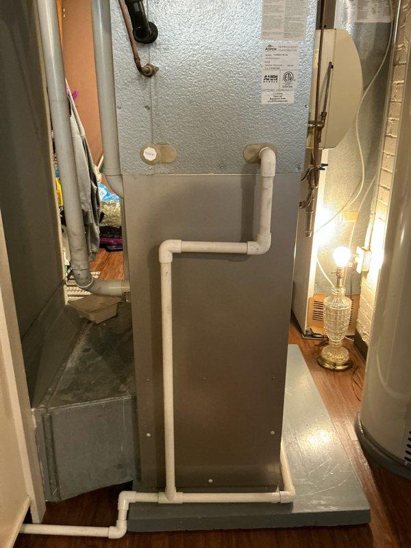 Performed comprehensive assessment of existing 20+ year old Bryant HVAC system experiencing refrigerant leak and multiple operational deficiencies. Evaluated air handler unit located in basement utility area, documented equipment condition including condensate drain configuration and refrigerant line routing, and prepared detailed replacement system estimate with equipment specifications and installation layout diagram.