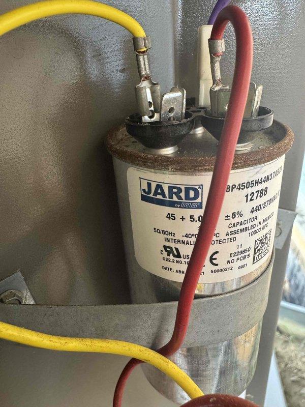 Completed MVP recurring cooling maintenance visit on residential air conditioning system. Performed comprehensive inspection of evaporator coil assembly, which showed excellent condition with clean, well-maintained fins and no signs of dirt buildup, corrosion, or damage. Inspected dual-run capacitor (JARD by Mars, 45+5 MFD, 440/370VAC) with secure wire connections and functional terminal assembly. All components operating within normal parameters with no service issues identified.