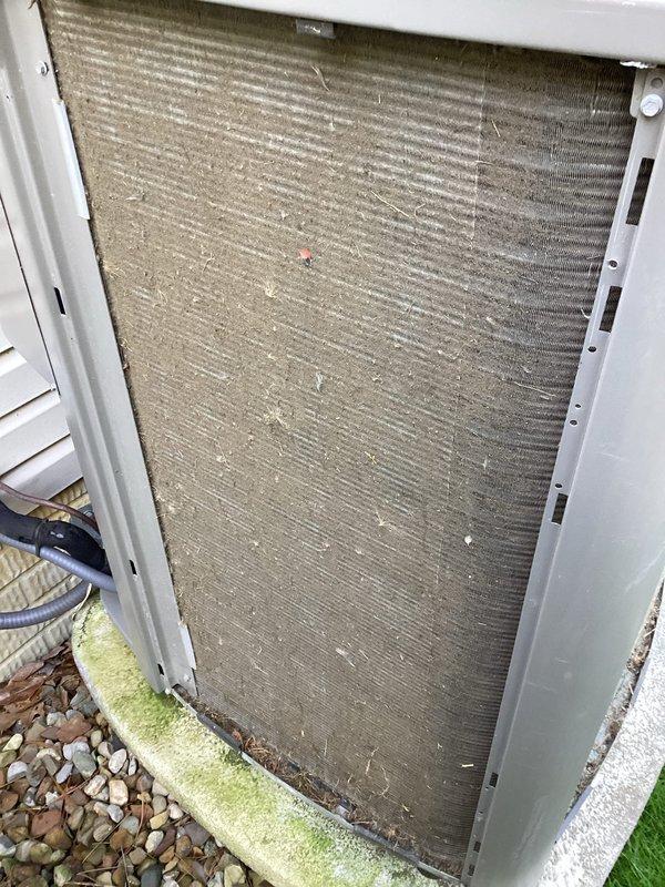 # HVAC Maintenance - Cooling

Completed recurring MVP cooling maintenance visit on outdoor condensing unit. Upon arrival, performed comprehensive inspection of condenser coil which revealed significant accumulation of dirt, dust, and debris throughout the fin structure, along with algae and moss growth on lower frame components from prolonged moisture exposure. Thoroughly cleaned condenser coil fins to remove environmental contaminants and restore proper airflow and heat transfer efficiency. Inspected electrical components and wiring for proper operation and secure connections. Unit returned to optimal operating condition with improved airflow through coil assembly.