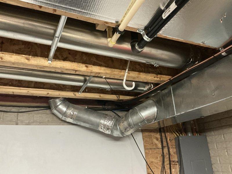 Completed electrical estimate for residential standby generator installation. Assessed existing HVAC infrastructure in basement utility area, including ductwork routing and available space for electrical conduit runs. Evaluated exterior installation location adjacent to existing HVAC condenser unit on concrete pad. Coordinated with HVAC sales team regarding mechanical system integration requirements. Documented site conditions including access to main electrical panel, gas line proximity, and exterior wall penetration points for transfer switch wiring. Verified HOA compliance requirements for generator placement and obtained necessary approval documentation for project progression.